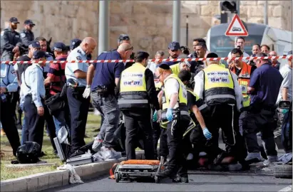  ?? PHOTO: GETTY IMAGES ?? Israeli emergency personnel at the scene of a terrorist attack outside Jerusalem’s Old City on Wednesday