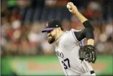  ?? MARK TENALLY — THE ASSOCIATED PRESS ?? Pat Neshek pitches for the Colorado Rockies on Saturday. Trading Neshek brought the Phillies three prospects who scouts say could be valuable.