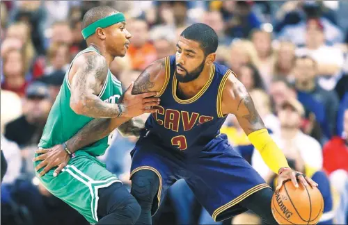  ?? AP FILE ?? Cleveland Cavaliers' Kyrie Irving looks to drive against Boston Celtics' Isaiah Thomas during a game in Cleveland in 2016. Irving, who asked to leave the Cavs earlier this summer, was traded to the Celtics on Tuesday for Thomas, Jae Crowder, Ante Zizic...