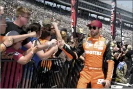  ?? AP photo ?? Chase Elliott, right, greets fans during driver introducti­ons before a NASCAR Cup Series race at Texas Motor Speedway in Fort Worth, Texas, on Sunday.