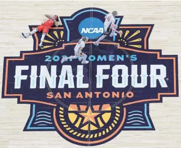  ?? ELSA/GETTY ?? Cameron Brink and Lexie Hull, of Stanford, run to celebrate with teammates after winning the 2021 NCAA Women’s Basketball Tournament championsh­ip game April 4 in San Antonio.