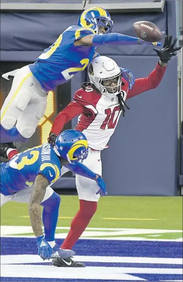  ?? Wally Skalij Los Angeles Times ?? JALEN RAMSEY breaks up a pass for Arizona’s DeAndre Hopkins in the end zone as John Johnson helps. The Cardinals’ best shot at a scoring drive ended in a blocked f ield goal. Neither offense found the end zone.