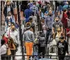  ?? JOHN SPINK/AJC 2021 ?? Hartsfield-jackson has seen crowds and long lines again, potentiall­y contributi­ng to unruly passenger behavior. Flight attendants also cite mask issues.