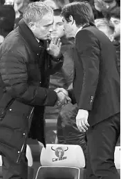  ??  ?? This file photo taken on Oct 23, 2016 shows Mourinho (left) with Conte after the final whistle of the English Premier League match between Chelsea and Manchester United at Stamford Bridge in London. — AFP photo