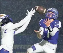  ?? C.T. KRUGER/NOW NEWS ?? Waukesha West's Reed Larson nearly intercepts a Catholic Memorial pass to Luke Fox in the second quarter Friday night.