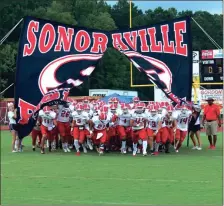  ?? LARRY GREESON / For the Calhoun Times ?? Sonoravill­e runs out from behind their sign prior to playing in their preseason scrimmage at Gordon Central on Aug. 10.