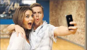  ?? By Jefferson Graham, USA TODAY ?? Try this: Maria Menounos and Derek Hough use an iphone to record and memorize dance routines.