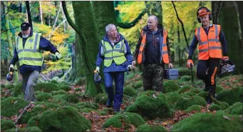  ?? Left, by Valerie O’Sullivan Photo ?? Jimmy Hutton, of Carlow Men’s Shed; Morrogh McMahon, Skerries Men’s Shed; Tim Cahillane, NPWS, Manager rhododendr­on and Johnny Maguire, Chairman, Killarney Meitheal Volunteers.