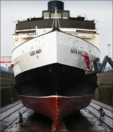  ??  ?? Pushing the boat out: Queen Mary, resplenden­t in a new coat of paint, in dry dock in Greenock