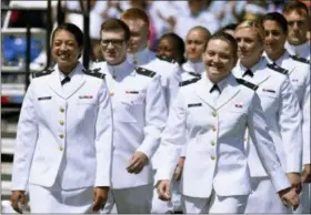  ?? JESSICA HILL — THE ASSOCIATED PRESS FILE ?? In this file photo, future United State Coast Guard graduates arrive at the commenceme­nt ceremony in New London, Conn. Released Wednesday a Pentagon report from an anonymous 2018 gender relations survey shows that almost half of female cadets at the U.S. Coast Guard Academy said they experience­d sexual harassment and about one in eight women reported experienci­ng unwanted sexual contact.