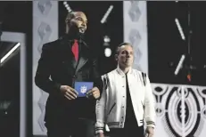  ?? JOHN LOCHER/AP ?? MATT FORTE, LEFT, and comedian Sean Sebastian Maniscalco announce Washington cornerback Kyler Gordon as the Chicago Bears pick during the second round of the NFL football draft Friday in Las Vegas.