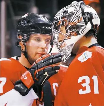  ?? Bruce Bennet Getty Images ?? Sidney Crosby congratula­tes goalie Carey Price after Team Canada’s victory in the first game of the World Cup of Hockey best-of-three final series. Crosby and Price undoubtabl­y have been the best players for the Team Canada in its run through the...