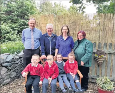  ??  ?? Back row from left: Mr Stewart Marsden (Head teacher), Mr John Welford (Head Gardener), Sue Stevenson (Volunteer) and Sue from Dobbies Garden Centre Front Row: Year 2 pupils