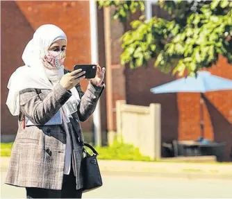  ?? SALTWIRE NETWORK ?? Health-care reporter Nebal Snan covers a news event for the SaltWire-owned Chronicle Herald in Halifax in August 2020. Her position was funded by the federal government's local journalism initiative program.