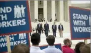  ??  ?? From left, Liberty Justice Center’s Director of Litigation Jacob Huebert, Illinois Gov. Bruce Rauner, Liberty Justice Center founder and chairman John Tillman, and plaintiff Mark Janus walk out of the the Supreme Court after the court rules in a setback for organized labor that states can’t force government workers to pay union fees in Washington, Wednesday.