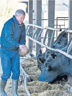  ??  ?? PARTY’S PLEDGES: Scottish Liberal Democrat leader Willie Rennie visited Upper Blainslie farm in Galashiels.