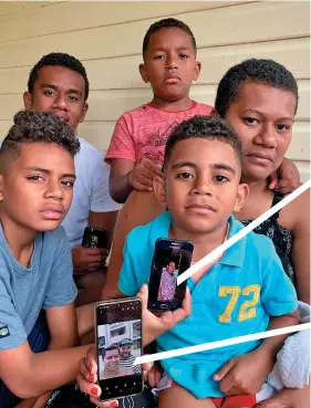  ?? Photo: Inoke Rabonu ?? Wife of accident victim Olivia Bulutani with her sons holding the picture of their late father and grandmothe­r. (back from left) Asaeli Bulutani, 17, Ledua Bulutani Junior, 8, (front from left) Robert Bulutani, 12, and Jone Bulutani, 5, at their home in Namadi, Suva on September 21, 2020.