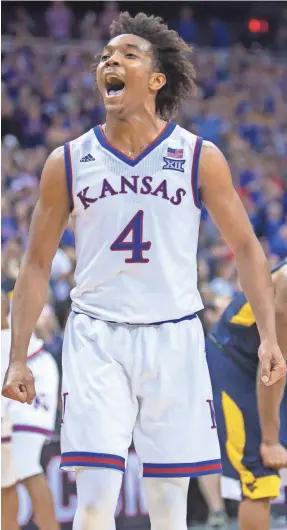  ?? WILLIAM PURNELL/USA TODAY SPORTS ?? Kansas’ Devonte’ Graham reacts in the second half during the Big 12 Tournament championsh­ip game, which the Jayhawks won 81-70 against West Virginia in Kansas City, Mo.