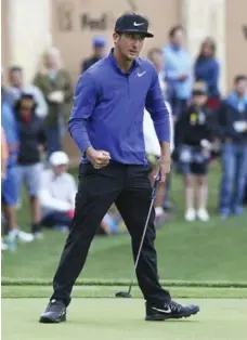  ?? TOM REEL/THE SAN ANTONIO EXPRESS-NEWS VIA THE ASSOCIATED PRESS ?? Kevin Chappell pumps his fist after sinking a par-saving putt on 18 to retain the lead during the third round of the Valero Texas Open golf tournament.