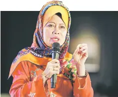  ??  ?? Fatimah delivers her remarks at the Carnation Club of Kuching and Samarahan Division’s 10th anniversar­y dinner. — Photo by Chimon Upon.