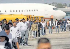  ??  ?? Not the best solution: Guatemalan­s deported from the United States arrive on an ICE charter flight to Guatemala City this month.