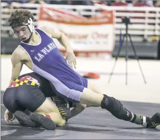  ?? PHOTO BY DARNELL MARBURY ?? La Plata junior Alex Blake defeated Mountain Ridge’s Camren Ritchey by a 4-1 decision to claim the Class 2A-1A 138-pound state title on Monday night at the state tournament at The Show Place Arena in Upper Marlboro. Blake concluded the season with a...