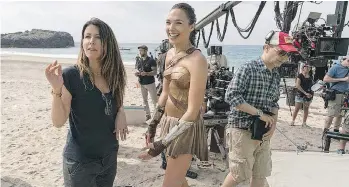  ??  ?? Wonder Woman star Gal Gadot, right, takes direction from Patty Jenkins and on the set.