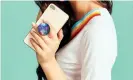  ??  ?? Give your phone a knob on the back with the collapsabl­e Popsocket. Photograph: Popsocket