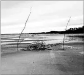  ?? BETHEL SEARCH AND RESCUE ?? A makeshift roadblock on a track marks a hole in the ice portion of the Kuskokwim River near Bethel, Alaska.