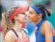  ?? AFP ?? Caroline Garcia (R) is congratula­ted by French compatriot Alize Cornet after their match at the Roland Garros on Monday.