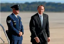  ?? AP ?? Deputy Attorney General Rod Rosenstein, right, walks on the tarmac after stepping off Air Force One at Andrews Air Force Base, Maryland. President Donald Trump said he and Rosenstein ‘just had a very nice talk’.
