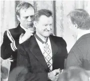  ?? ASSOCIATED PRESS ARCHIVE ?? President Jimmy Carter shakes hands with his national security adviser, Zbigniew Brzezinski, as he presents Brzezinski with the Medal of Freedom in 1981.