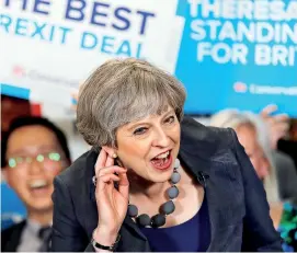  ??  ?? Britain's Prime Minister Theresa May reacts as she speaks at an election campaign event at Pride Park Stadium in Derby, Britian. Election are due on Thursday. REUTERS/Stefan Wermuth