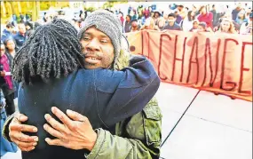  ?? Peter Hvizdak / Hearst Connecticu­t Media ?? Corey Menafee, a Yale employee, hugs Kica Matos, director of Immigrant Rights and Racial Justice at the Center for Community Change, during a rally by a coalition of city groups and the Yale University community in Beinecke Plaza in front of Woodbridge Hall in New Haven, protesting the name of Yale’s Calhoun College and calling for its renaming. It was renamed Grace Hopper College.