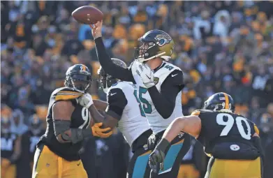  ?? GEOFF BURKE/USA TODAY SPORTS ?? Jacksonvil­le quarterbac­k Blake Bortles made several important throws during Sunday’s 45-42 victory against Pittsburgh.