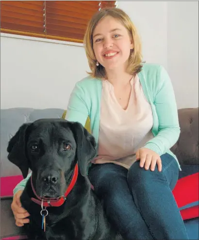  ?? PICTURE: LAURILEE McMICHAEL ?? WORKING FOR OTHERS: Taupo¯ woman Eilish Wilkes received a Volunteer of the Year award at Parliament for her work with young people living with cancer. She is pictured with her guide dog, Loie.