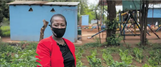  ?? Photo: Chris Collingrid­ge ?? Miriam Mogatla runs the Phahamang Basadi food garden located in Phuthanang, Free State province.