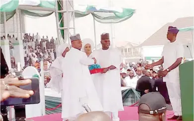  ?? Photo: Tijani Labaran ?? Former Kogi State Governor, Yahaya Bello (R), handing over to Ahmed Usman Ododo in Lokoja yesterday.