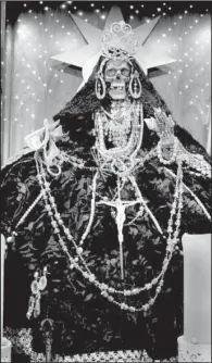  ?? File photo ?? Devotion to the folk saint La Santa Muerte, which means Holy Death, is popular in Mexico and interest is growing throughout the Americas, particular­ly in the United States.