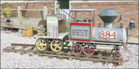  ?? (NWA Democrat-Gazette/Susan Holland) ?? A model train, pictured in September, arrived from Medford, Ore., to sit in the front yard of Belva Hughes on El Paso Street S.E. near the Gravette Middle School and Glenn Duffy Elementary. The front part of the train, which was made by Belva’s husband John in the mid-1970s, was originally a wood stove in the Hughes family’s Oregon home.