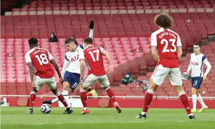  ?? Photograph: Charlotte Wilson/ Offside/Getty Images ?? Erik Lamela scores the opening goal with a rabona, but Tottenham lost the derby against Arsenal 2-1.