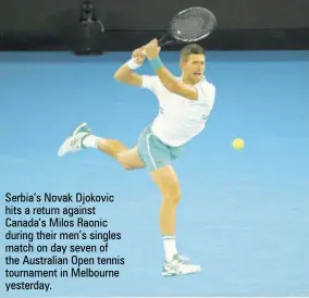  ??  ?? Serbia’s Novak Djokovic hits a return against Canada’s Milos Raonic during their men’s singles match on day seven of the Australian Open tennis tournament in Melbourne yesterday.