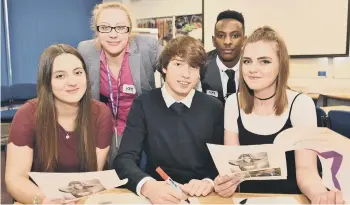  ??  ?? RSA Insurance staff meeting Y12 students at Ken Stimpson School .