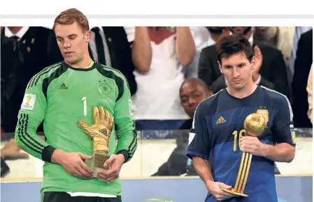  ?? ?? Prized possession: Germany’s goalkeeper Manuel Neuer and Argentina’s captain Lionel Messi hold their Golden Glove and Golden Ball trophies respective­ly during the presentati­on ceremony. The South American side and Messi were left to regret a slew of missed opportunit­ies in the final.afp