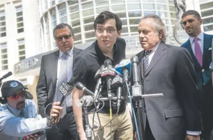  ?? Drew Angerer, Getty Images ?? Martin Shkreli speaks to the media Friday after a jury in federal court in Brooklyn found the former hedge fund manager guilty on three counts involving securities fraud and conspiracy to commit securities and wire fraud.