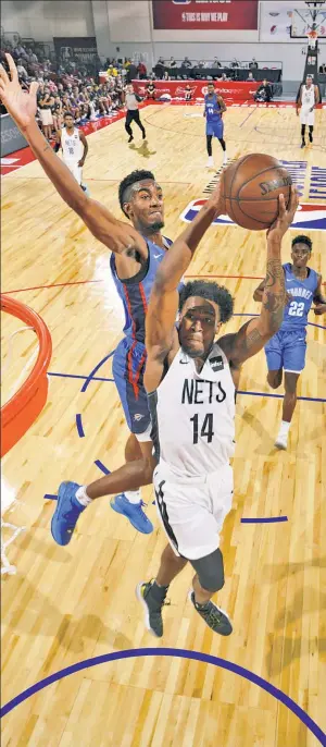  ?? Getty Images ?? SEND IT IN! Bryant Crawford goes to the basket during summer league action Saturday night in Las Vegas. The undrafted Wake Forest product finished with three points on 1-for-6 shooting in the Nets’ 90-76 loss to the Thunder.