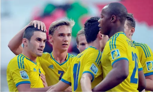  ??  ?? Sweden players celebrate a goal against Argentina during the third place match at the Mohammed bin Zayed Stadium on Friday