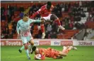  ??  ?? Freddie Woodman (bottom) made a series of important saves for Swansea. Photograph: Laurence Griffiths/Getty Images