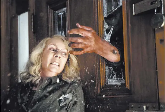  ?? Ryan Green Universal Pictures ?? Forty years after the original “Halloween,” Jamie Lee Curtis is back as Laurie Strode in a scene from the current “Halloween.”