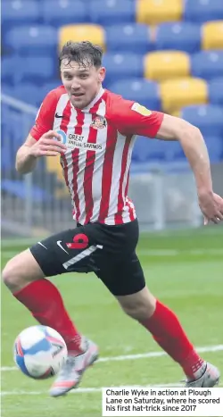  ??  ?? Charlie Wyke in action at Plough Lane on Saturday, where he scored his first hat-trick since 2017